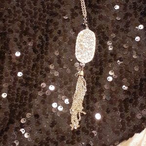 Long Silver tone tassle Necklace.